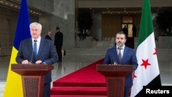 乌克兰外长安德烈·西比加与叙利亚新任外长阿萨德·哈桑·什巴尼共同召开记者会,说明两国强化关系的举措。(路透社:2024年12月30日)