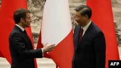 中国国家主席习近平在北京会晤到访的法国总统马克龙。(2023年4月6日)