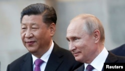 资料照片:中国国家主席习近平和俄罗斯总统普京。(2019年6月5日)