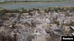 မီးရှို့ဖျက်ဆီးခံရတဲ့ စစ်ကိုင်းတိုင်းအတွင်းက ကျေးရွာတရွာ (ဓါတ်ပုံ - Reuters)