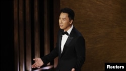 港区中国全国政协委员甄子丹2023年3月12日出席奥斯卡金像奖颁奖典礼,一些活动人士反对他支持北京的言论。