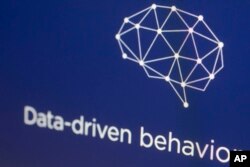 Grafik dari situs Cambridge Analytica ditampilkan di layar komputer di New York, 18 April 2018. (AP/Mark Lennihan)