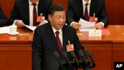 中国国家主席习近平在北京人民大会堂的全国人大闭幕式上发表讲话。(2023年3月13日)
