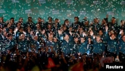 2024年1月13日，台湾当选总统赖清德和他的竞选伙伴萧美琴在台北参加总统选举胜利后的集会。(路透社）