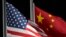 FILE - The U.S. and Chinese flags wave in Zhangjiakou, China, Feb. 2, 2022. The U.S. State Department recently modified its online fact sheet on China, dropping the country’s official name in favor of just using China.