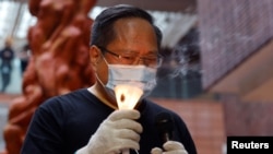 香港前支连会副主席何俊仁2021年5月参与一场纪念六四事件的活动。(路透社)
