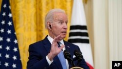 2021年5月21日,拜登总统和韩国来访总统文在寅在白宫举行的联合记者会上答记者问。