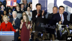 在爱奥华州党团会议选举中初战告捷的希拉里·克林顿和泰德·克鲁兹。 (2016年2月1日)