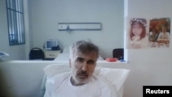 格鲁吉亚前总统萨卡什维利在诊所内通过视频连线参加法庭听证。(2023年2月1日)
