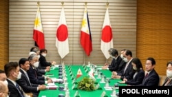 资料照片:日本和菲律宾领导人在举行会谈。