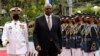 Menteri Pertahanan A.S. Lloyd Austin (kedua dari kiri) berjalan melewati pasukan kehormatan setibanya di Departemen Pertahanan Nasional di kamp militer Camp Aguinaldo, Quezon City, Metro Manila, Filipina, Kamis 2 Februari 2023. (Rolex Dela Pena/Pool Photo via AP)