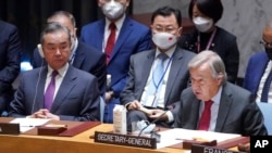 中国外交部长王毅和联合国秘书长古铁雷斯