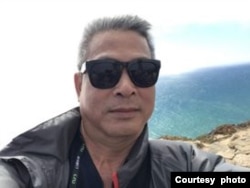 位于台北的资深新闻工作者朱建陵。(照片提供:朱建陵)