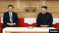 朝鲜领导人金正恩2019年6月21日在平壤会晤到访的中国国家主席习近平。(朝鲜朝中社发布)