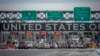 FILE - Cars wait in line to enter the United States at a border crossing at the Canada-U.S. border in Blackpool, Quebec, Canada, on Feb. 2, 2025. 