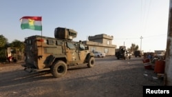 资料照片:伊拉克军队在基尔库克市郊外加紧部署,试图夺回伊斯兰国一天前占领的村庄(2021年12月6日)