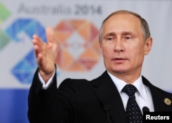 俄罗斯总统普京在2014年G20峰会结束时在记者招待会上讲话。(资料照片)