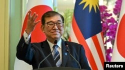 日本首相石破茂出访马来西亚和印度尼西亚,寻求强化与东盟在国防与经济领域的合作。(路透社:2025年1月10日)