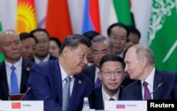 Presiden Rusia Vladimir Putin dan Presiden China Xi di KTT BRICS di Kazan, Rusia, 24 Oktober 2024. (Foto: REUTERS/Maxim Shemetov)