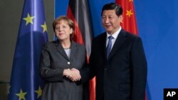 中国国家主席习近平与德国总理默克尔今年早些时候在柏林会晤