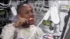 Astronaut brushing teeth