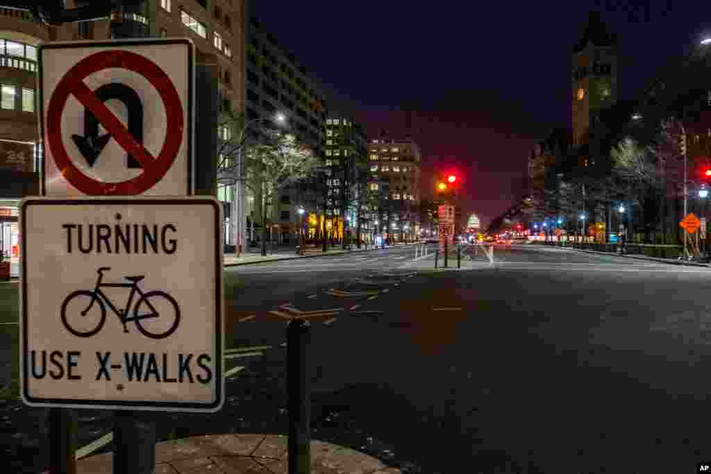 Pennsylvania Avenue looking toward the U.S. Capitol in Washington is virtually empty early in the morning, Jan. 22, 2016 as the Nation's capital hunkered down in preparation for a major snow storm expected to begin later in the day.