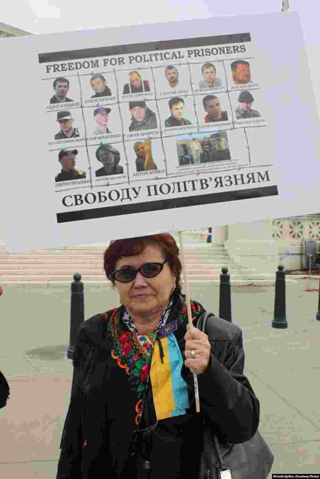 Birds sit in cages hanging from poles during a bird-singing contest in the Rueso district of Thailand's southern province of Narathiwat.