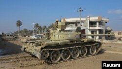 Binh sĩ Iraq tham gia cuộc hành quân để chiếm lại những khu vực trong thành phố Ramadi, tỉnh Anbar ở miền tây Iraq.