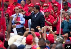 Venezuela's President Nicolas Maduro speaks to oil workers during a demonstration outside Miraflores Presidential Palace after he met with U.S. diplomat Thomas Shannon in Caracas, Venezuela, June 22, 2016.