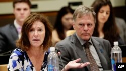 Fred Warmbier listens as his wife, Cindy, speaks of their son Otto, an American who died in 2017 days after his release from captivity in North Korea, during a meeting at U.N. headquarters, May 3, 2018.