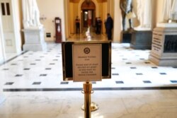 A sign indicating proper social distancing measures is displayed ahead of a vote in the House of Representatives on an additional coronavirus economic stimulus package, on Capitol Hill, April 23, 2020.