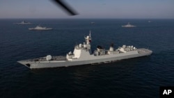 2023年3月17日,在伊朗陆军官方网站发布的这张照片中,军舰参加伊朗、中国和俄罗斯在阿曼湾举行的联合海军演习。