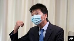 2021 年 6 月 30 日星期三,王靖渝在乌克兰的一个安全屋接受采访时说。他和他的未婚妻正在逃避引渡到中国的威胁。