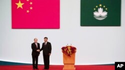 中国国家主席习近平在澳门出席新任澳门行政长官贺一诚的就职仪式。(2019年12月20日)