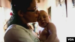 ZIKA VIRUS ပိုးကူးစက်ခံရသူ ကလေးငယ်နဲ့မိခင်။