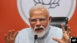 Indian Prime Minister Narendra Modi makes a press statement at the party headquarters in New Delhi, India, May 17, 2019.