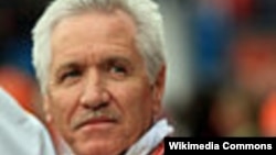 A mourner is seen through a barricade in Kyiv's Independent Square.