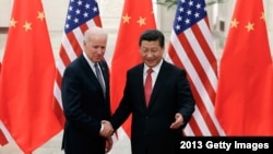 资料照：2013年12月4日拜登访问北京与中国国家主席习近平会面 