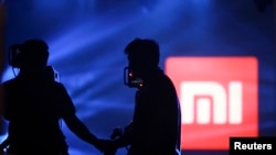 北京一次小米平板电脑发布会上展示的小米标识。(2014年5月15日)