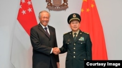 新加坡国防部长黄永宏2019年5月29日会见到访的中国防长魏凤和（新加坡国防部照片）