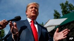 美国总统川普在白宫北草坪对记者讲话。(2018年6月15日)