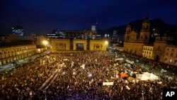 People gather at Bolivar's square during a peace march in Bogota, Colombia, Oct. 12, 2016. Thousands of rural farmers, indigenous activists and students marched in cities across Colombia to demand a peace deal between the government an leftist rebels not