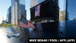 资料照片:9/11恐怖袭击事件11周年期间的纽约市9/11纪念园。(2012年9月11日)