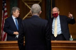 Senator Roy Blunt, R-Mo. and Sen. Lamar Alexander, R-Tenn., speak with Dr. Francis Collins, Director of the NIH, after he testified at a hearing on the plan to research, manufacture and distribute a coronavirus vaccine, known as Operation Warp Speed.