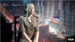 实名举报中央办公厅高官员的中国旅游与经济电视台女主持人纪英男(美国之音东方拍摄)