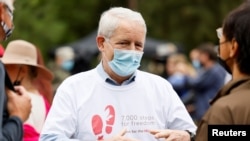 加拿大外长加诺(Marc Garneau)2021年9月5日在渥太华参加集会争取斯帕弗和康明凯获释(路透社)