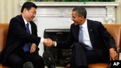 2012年2月14日奥巴马总统在白宫椭圆形办公室会见习近平。（路透社）