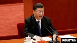 资料照片:2021年10月9日中国国家主席习近平在北京人民大会堂举行的“纪念辛亥革命110周年大会”上发表讲话。