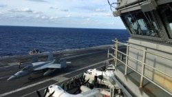 美国海军里根号航母参加与日本海上自卫队和加拿大皇家海军在西太平洋举行的大规模“利剑”联合军演(路透社2018年11月3日)