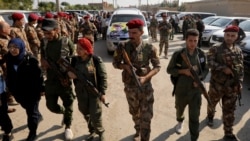 资料照片:叙利亚民主军战士在叙利亚东北的卡米什利镇为阵亡战友举行葬礼。(2019年10月22日)